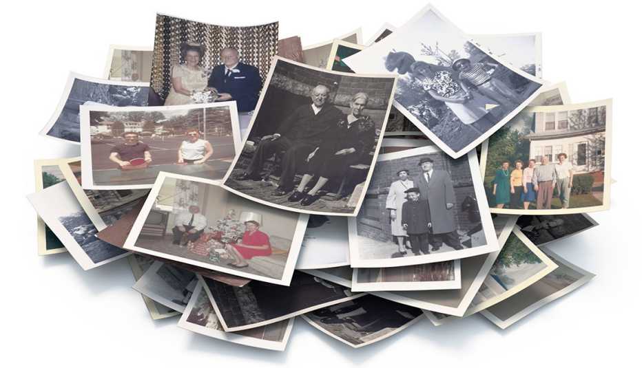 stack of old photos in a pile showing a family through the years