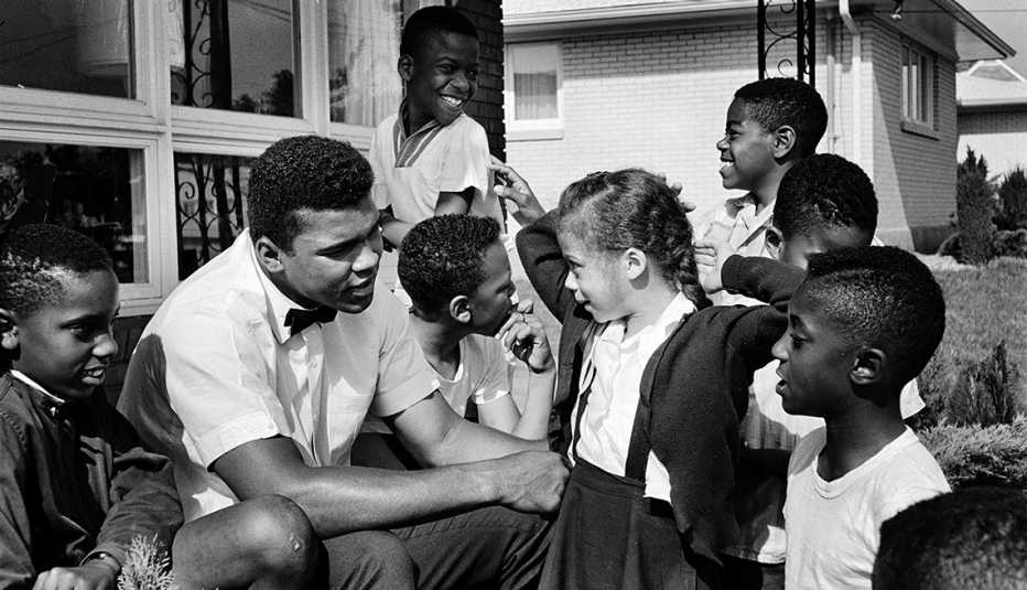 Lonnie and Mohammed Ali, Muhammad Ali with neighborhood kids in Louisville, including Yolanda "Lonnie" Williams who would become his wife in 1986
