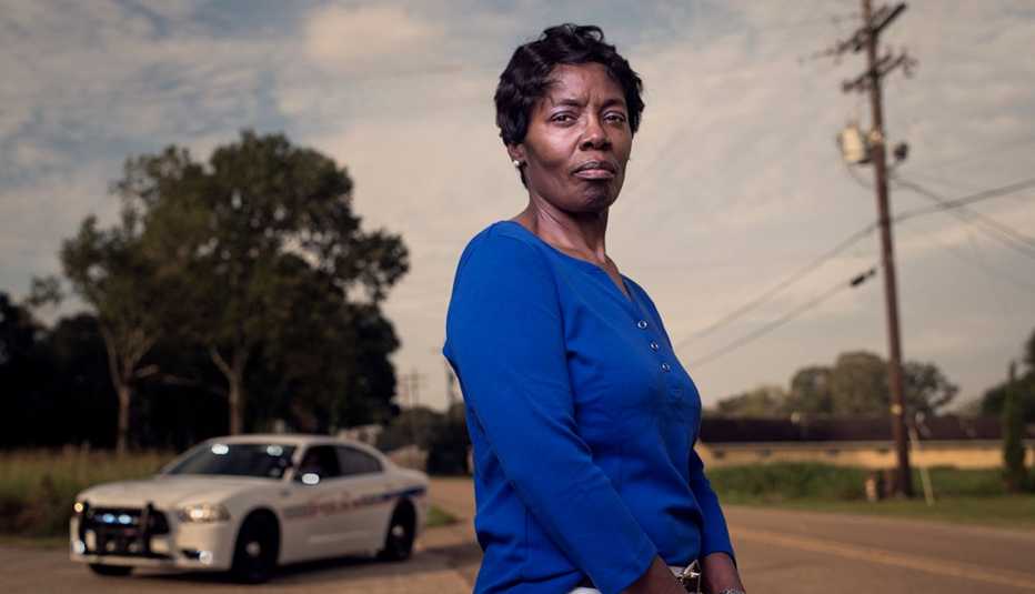 Vickie Williams-Tillman standing in front of where she jumped on the criminals back