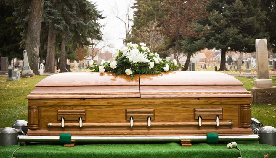 casket with flowers on top of it