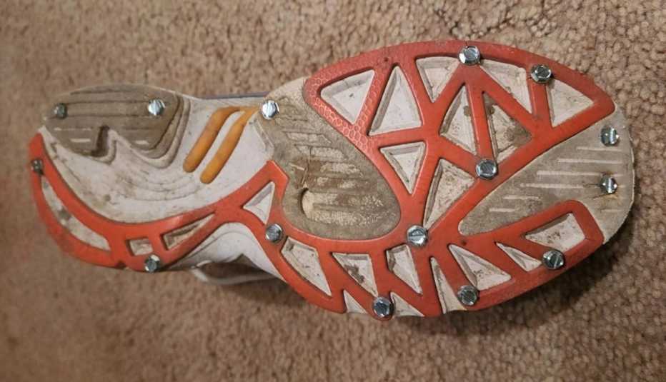 Jilly Whiting of Illinois puts sheet metal screws into the bottom of her running shoes for better traction in the winter