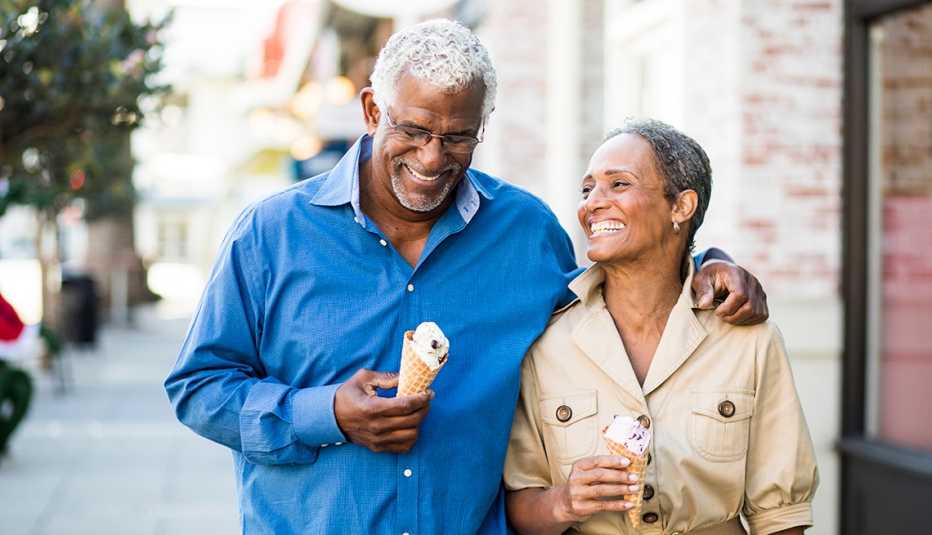 A mature couple enjoy an evening on the town with ice cream