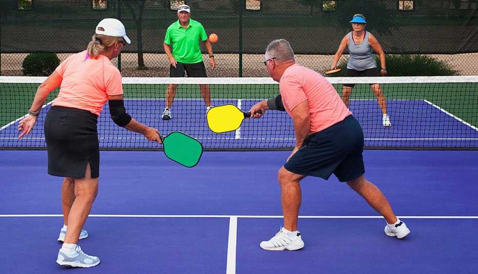 Two couples play pickleball, a game that's kind of like tennis and has nothing to do with pickles