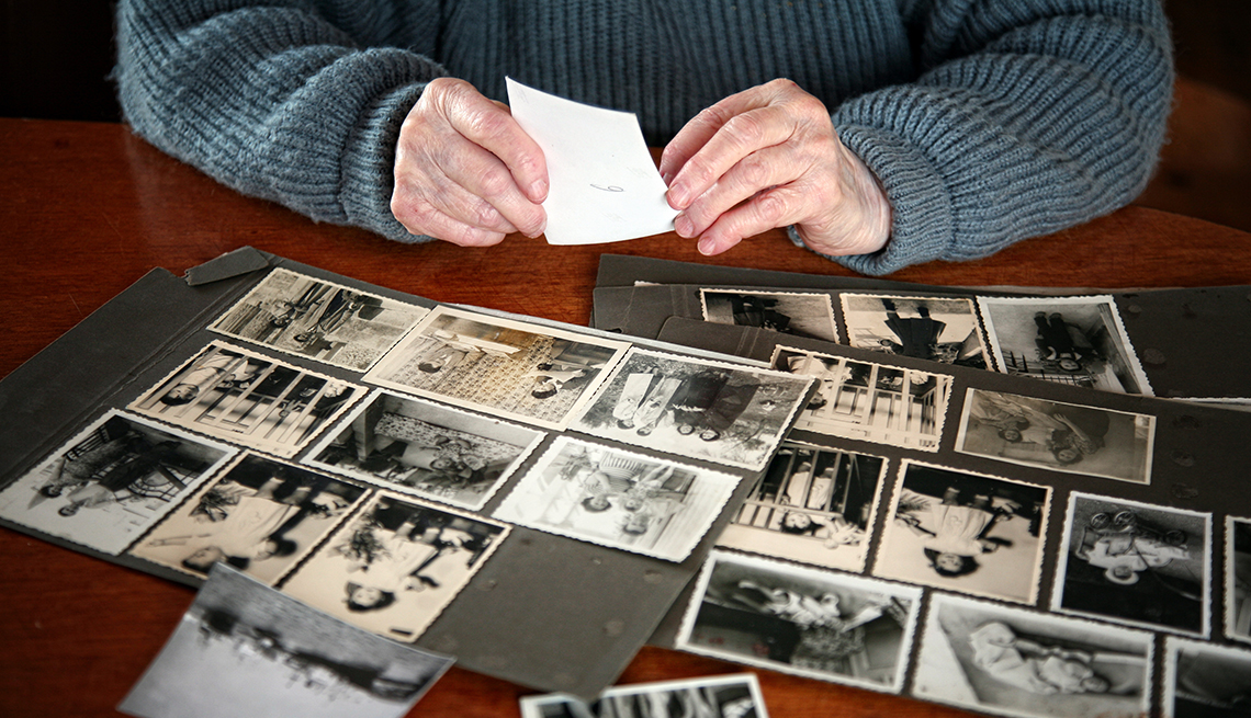 A person is looking through old family photos
