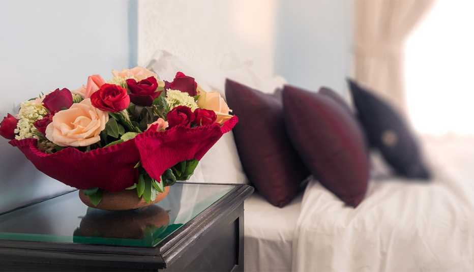 Bouquet of flowers on the bedroom nightstand