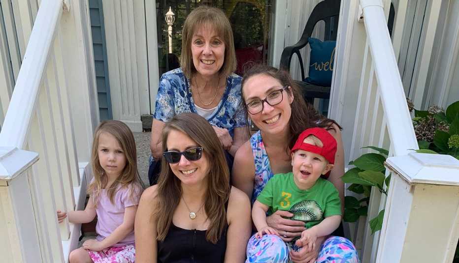 pamela addison at top with her grandchildren and their mother joanne swan and her other daughter kimberly khilnani addison is helping raise the children after the death of her son in law from covid nineteen