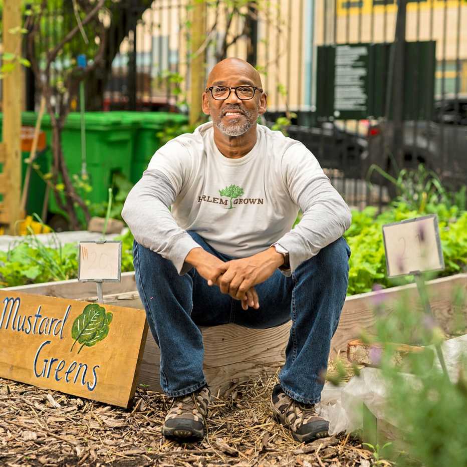 Tony Hillery, founder and executive director of Harlem Grown, poses for a portrait at the 134th street Harlem Grown garden.Elias Williams for AARP