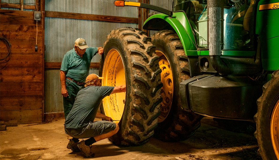 steve and curran vetter working on a tractor