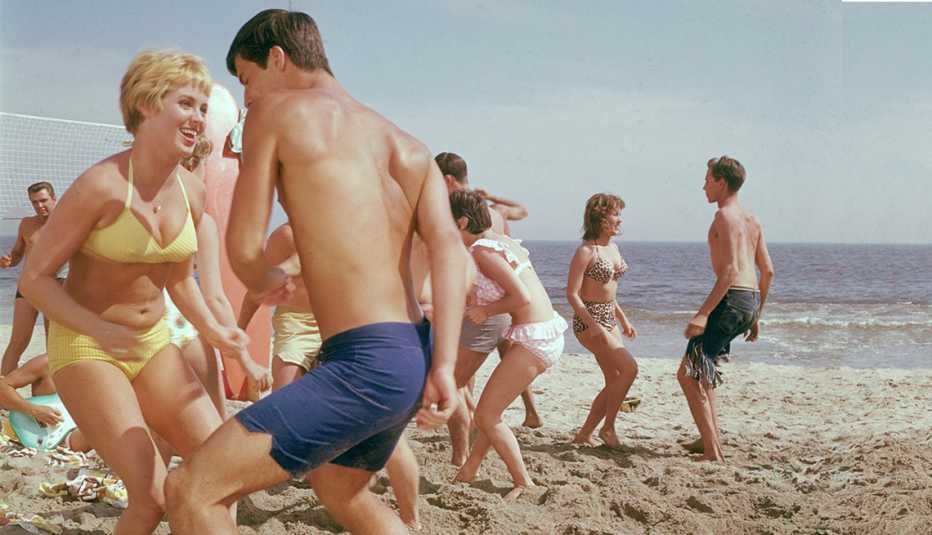beach goers dance on a sunny day