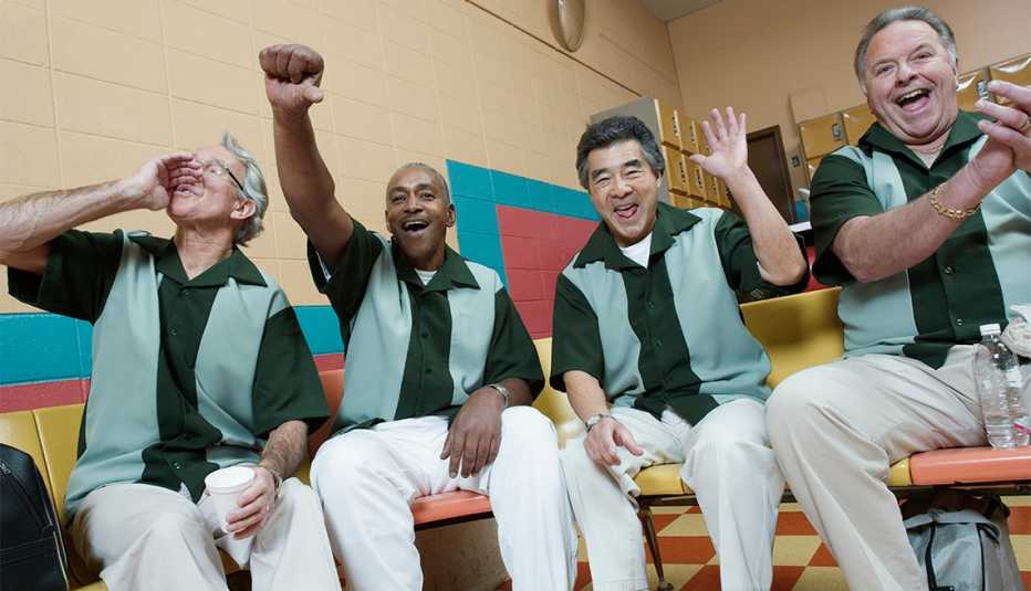 group of men from a bowling league, cheering 