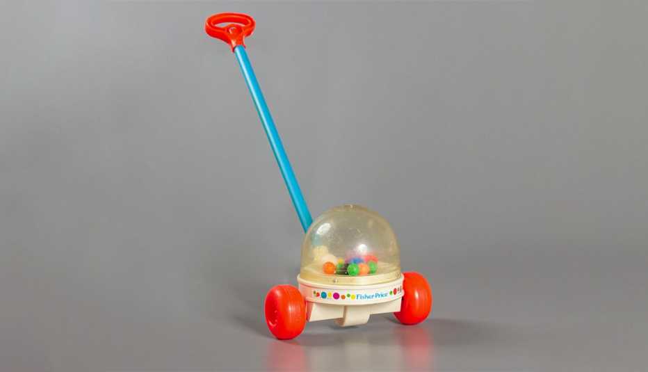 the fisher price corn popper a stick attached to a plastic dome full of gumball sized balls that pop as it moves