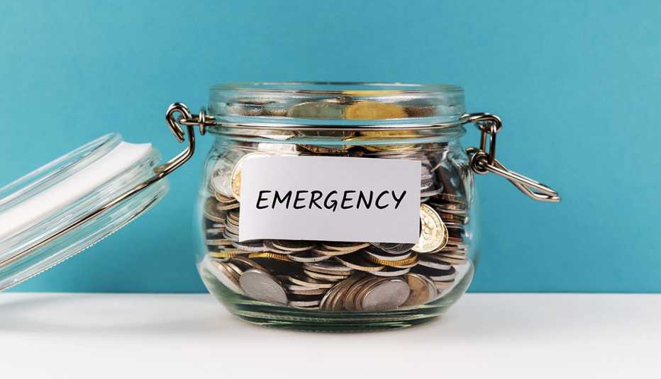 a jar of change labeled emergency