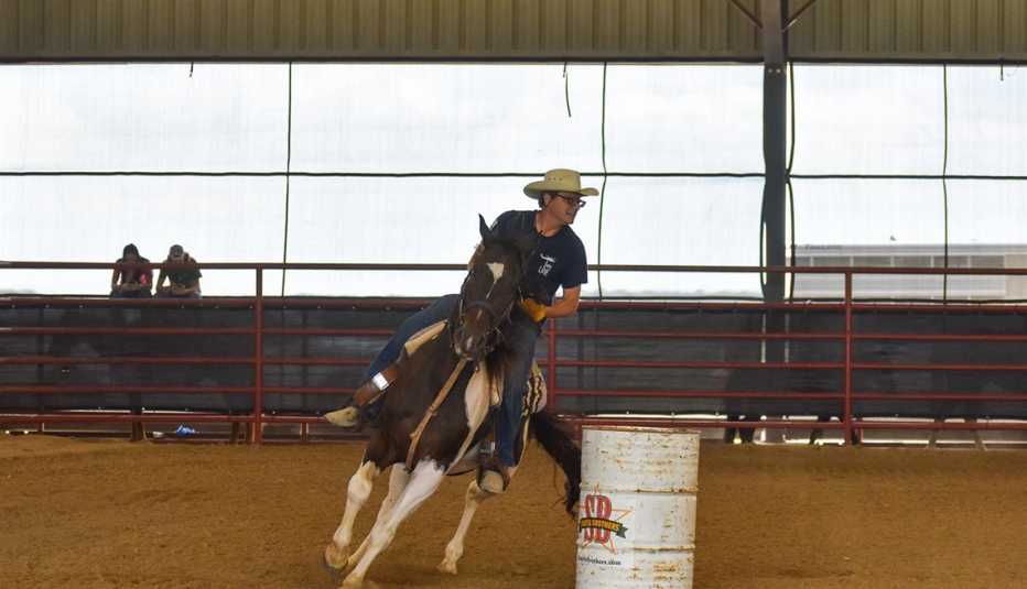 Martin Stein barrel racing while on a horse