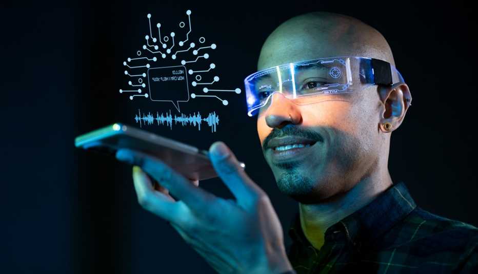 a man with a smart phone and smart glasses