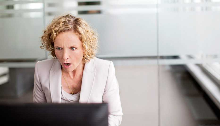 Surpised woman in office, Following An Internet Ad 