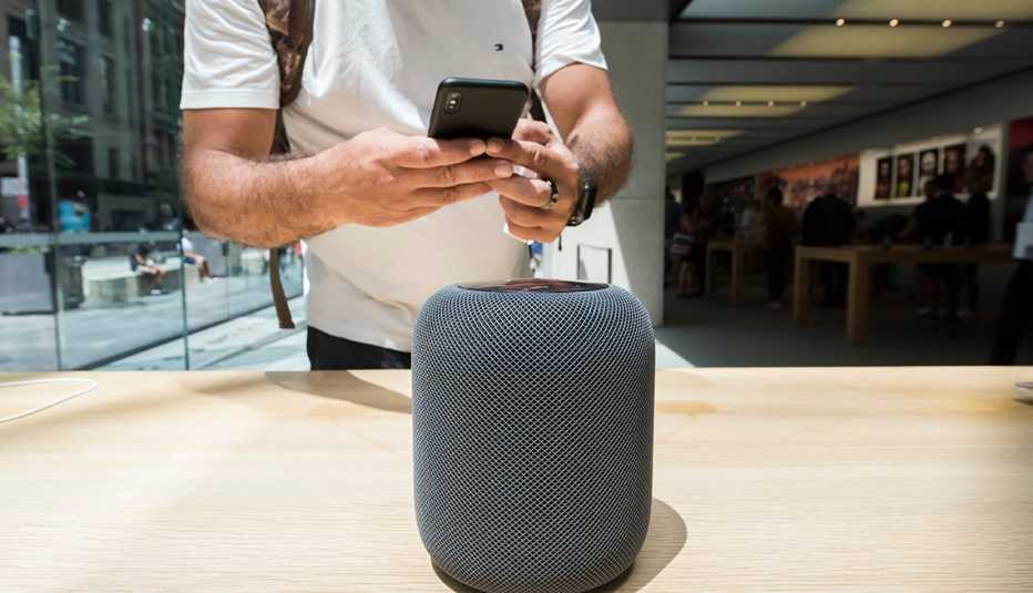 A customer uses his iphone to photograph the new HomePod during the launch of the HomePod at the Apple Store on February 9, 2018 in Sydney, Australia. Apple's latest innovation, released in the US, UK and Australia today, is a smart speaker and digital as