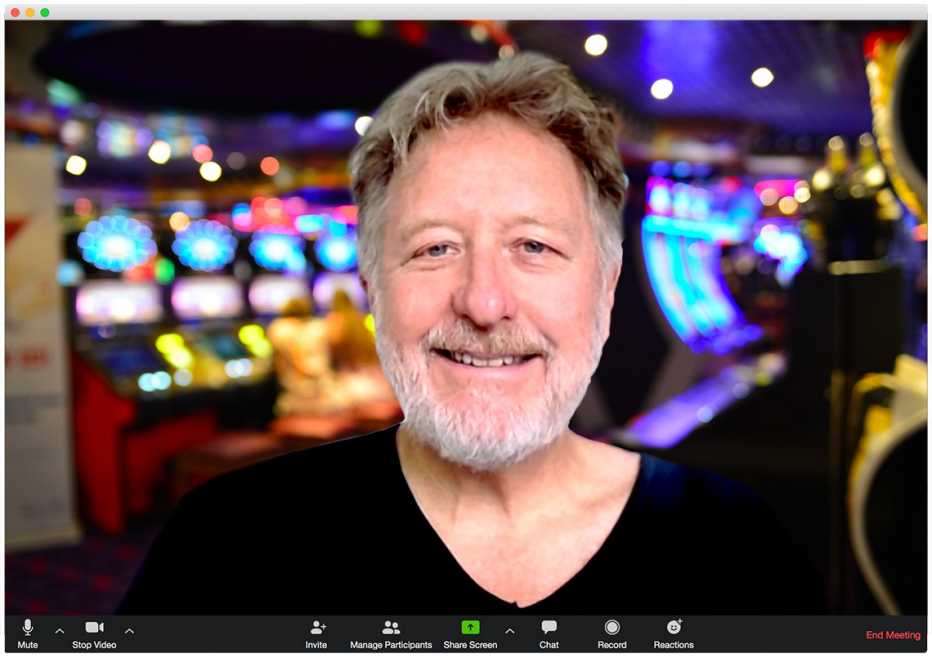 man as appearing on a zoom call in a browser window with casino background