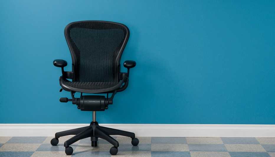 Single office chair in austere office.*