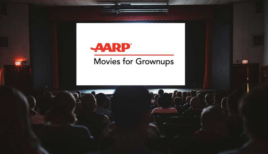People watching a movie screen that reads AARP Movies for Grownups