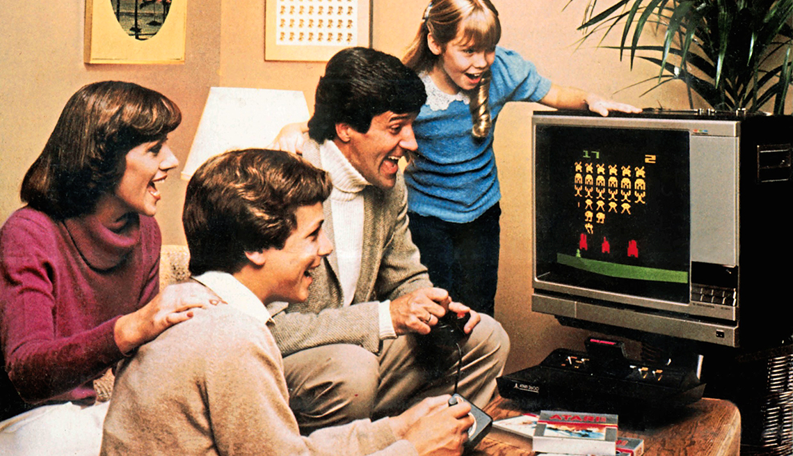 vintage photo from nineteen seventy eight of family playing space invader video game