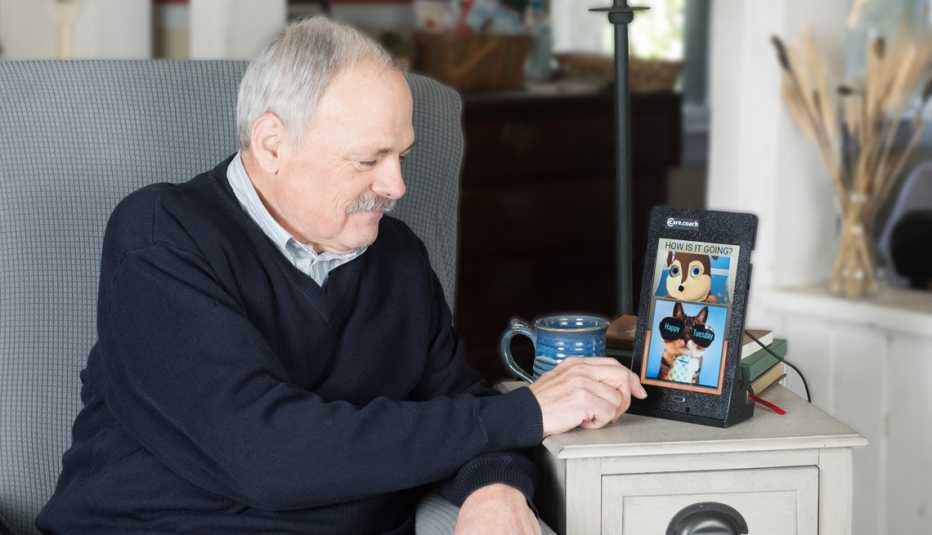 a man interacting with the care coach app on his tablet