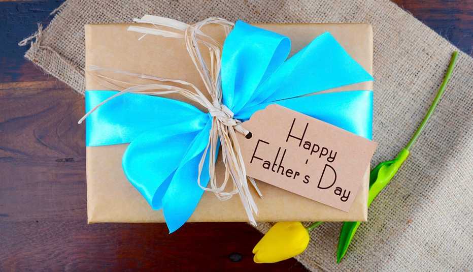 A Father's Day gift wrapped with a blue ribbon