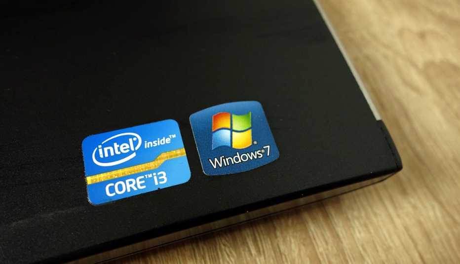 Intel Core i3 and Windows 7 sticker on laptop