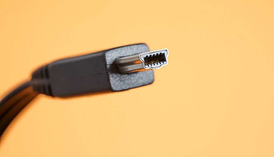 a close-up of a mini usb on a yellow background
