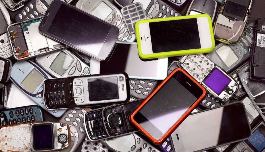 a pile of cellphones of varying color and design