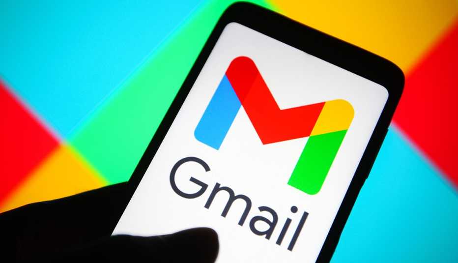 a smartphone with a gmail logo over a field of primary colors