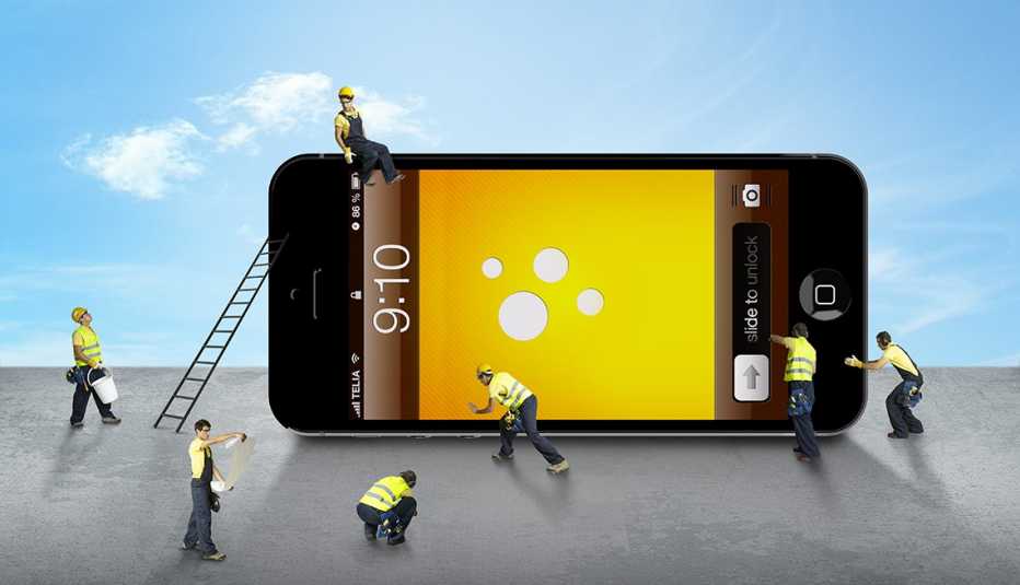 tiny construction workers simulate operating on a smartphone with a yellow screen with a blue sky in the background