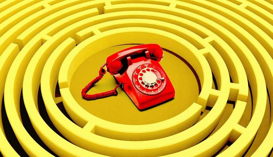 a red telephone sits in the middle of a yellow concentric maze