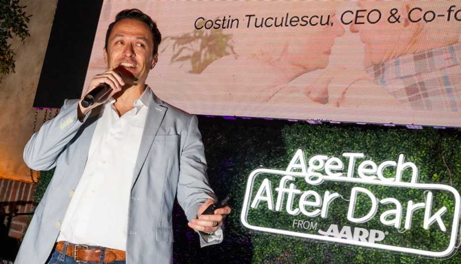 costin tuculescu of onscreen talks into a mic at agetech after dark