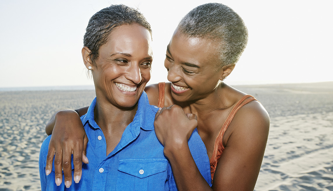 Two African American Ladies Embrace On Beach, Can Sexual Preference Change Over Time?
