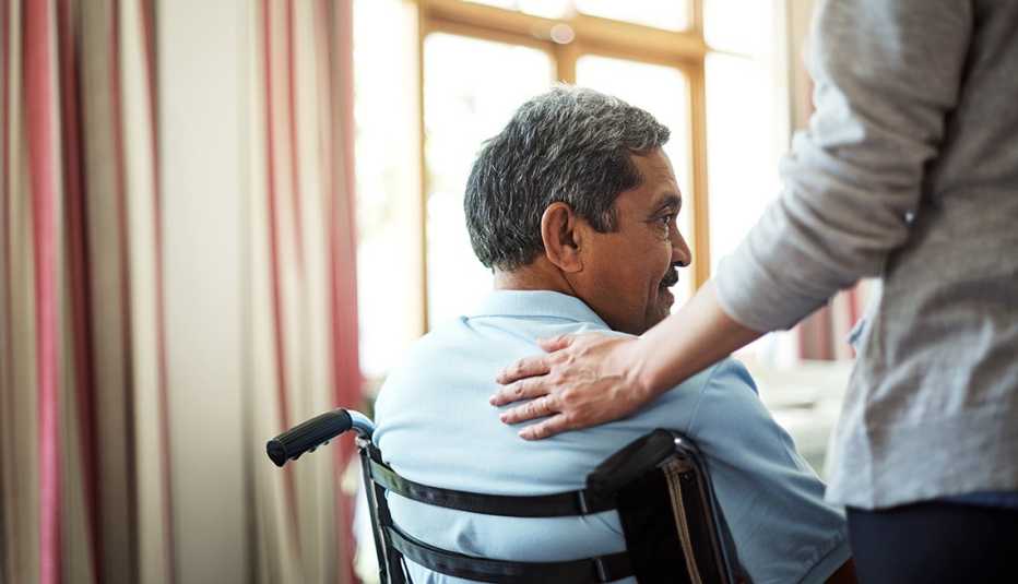 A nurse caring for a senior man