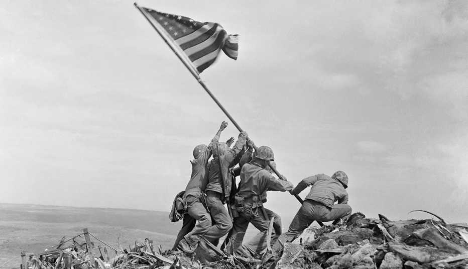 Marines raising an American flag during the battle of Iwo Jima