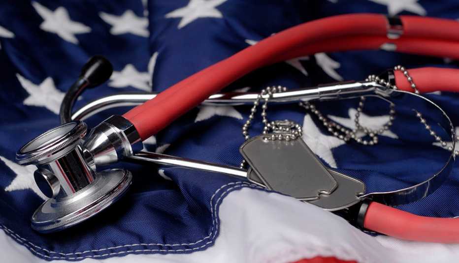 Dog tags and a stethoscope on the American flag