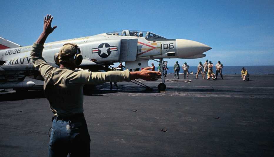 A plane is getting ready to take off from an aircraft carrier