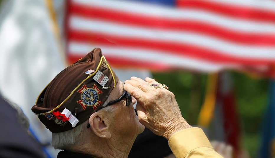 A veteran salutes the flag
