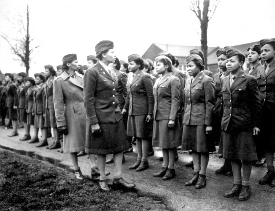 A unit of African American women are being inspected by instructors during World War Two