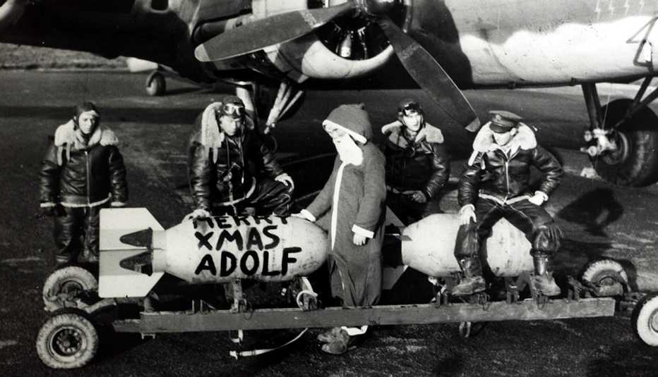 pilots sit on top of bombs that say merry christmas adolf