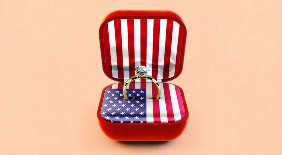 a ring is in a case with an american flag in the background