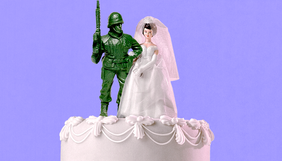 a green toy soldier sits on top of a wedding cake with a bride