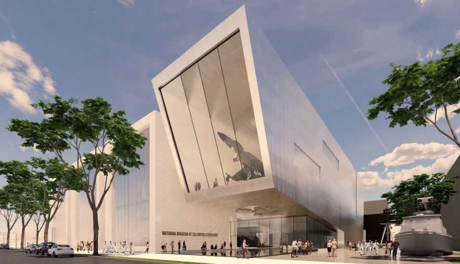 a photo illustration depicts the outside of a building surrounded by blue skies and trees. the modern building includes floor to ceiling windows, with a plane inside the museum.