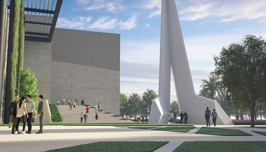 a photo illustration shows a tall, white triangle sculpture outside a gray, multi-story modular building. the building is the future p o w m i a museum.