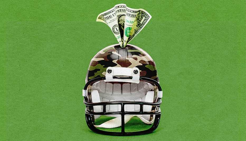 A camouflage football helmet acts as a piggy bank with a dollar sticking out of the top.