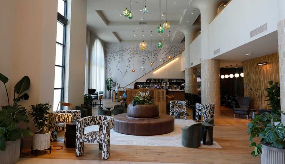 high ceilings and modern furniture fill the lobby of the kissel uptown oakland hotel