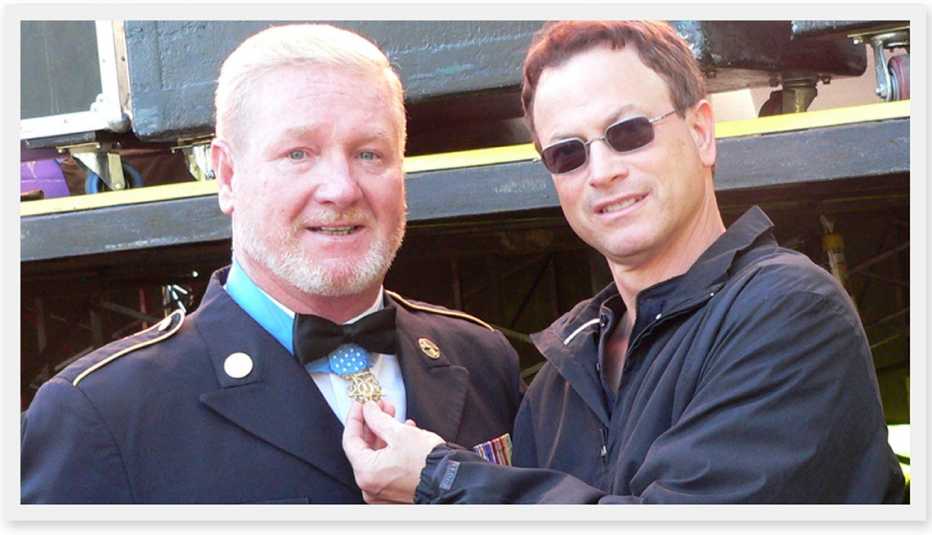 actor gary sinise poses with a medal of honor recipient