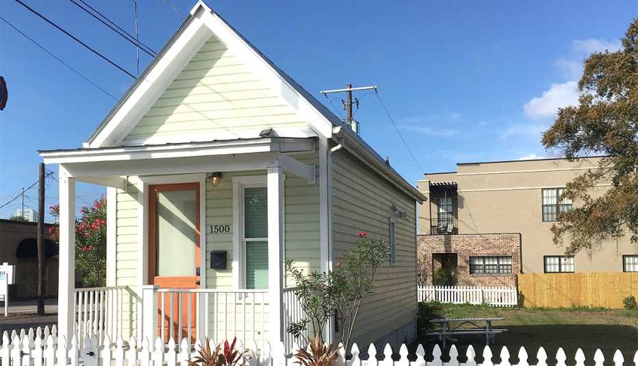 A tiny home with a small fenced yard