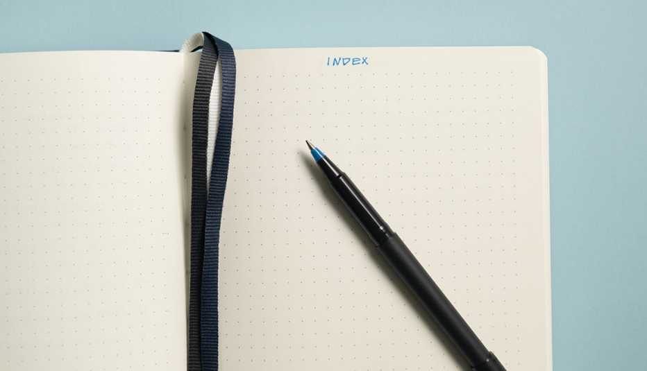 an open notebook with the word index written on it